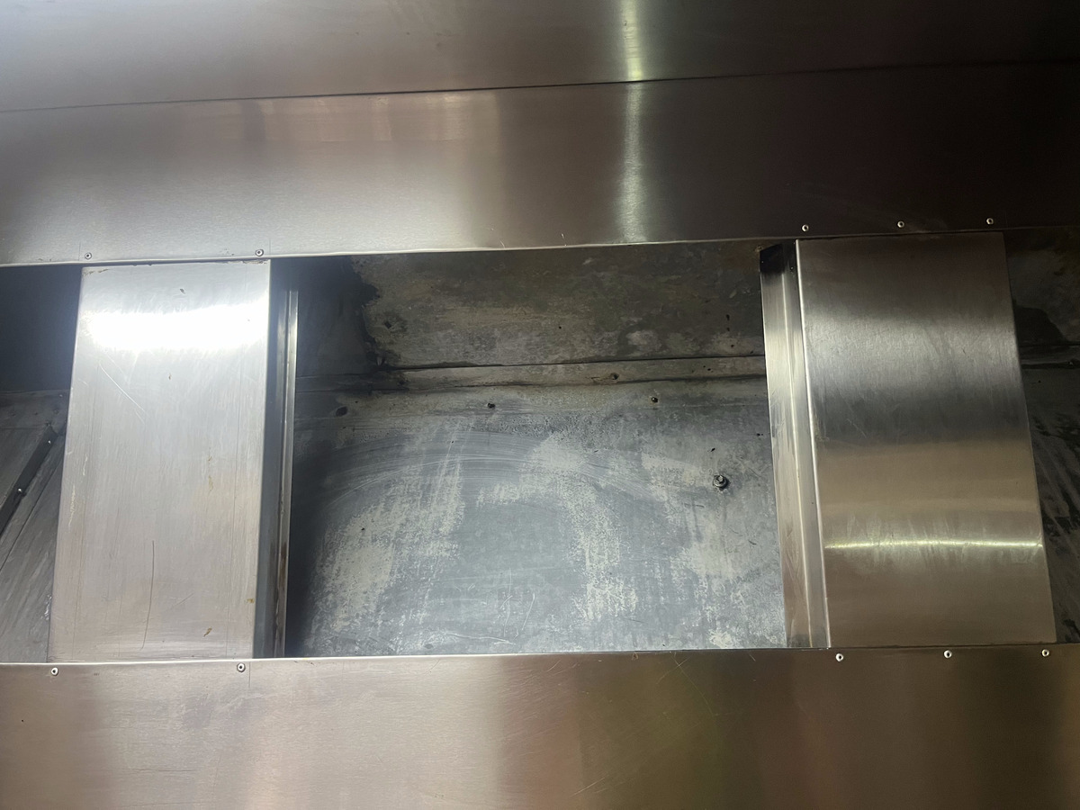 clean commercial range hood and canopy